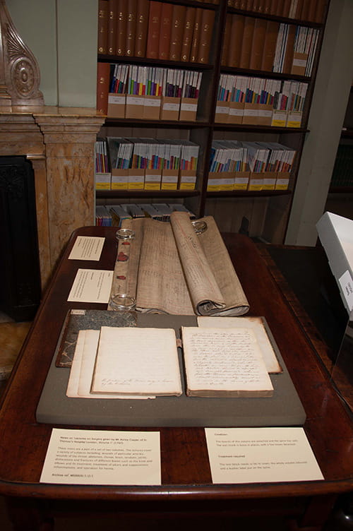 Books and manuscripts displayed on a table