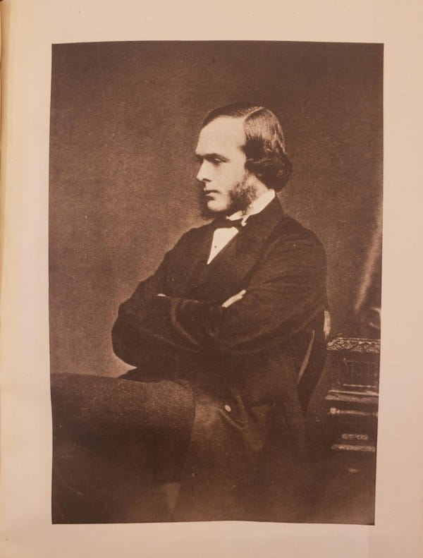 Sepia image of a seated man