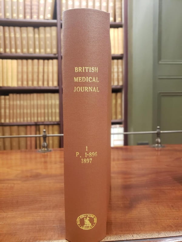 Spine of a brown fabric-covered volume, labelled "British Medical Journal, 1 P. 1-896 1897" and bearing the RCS England Library stamp.