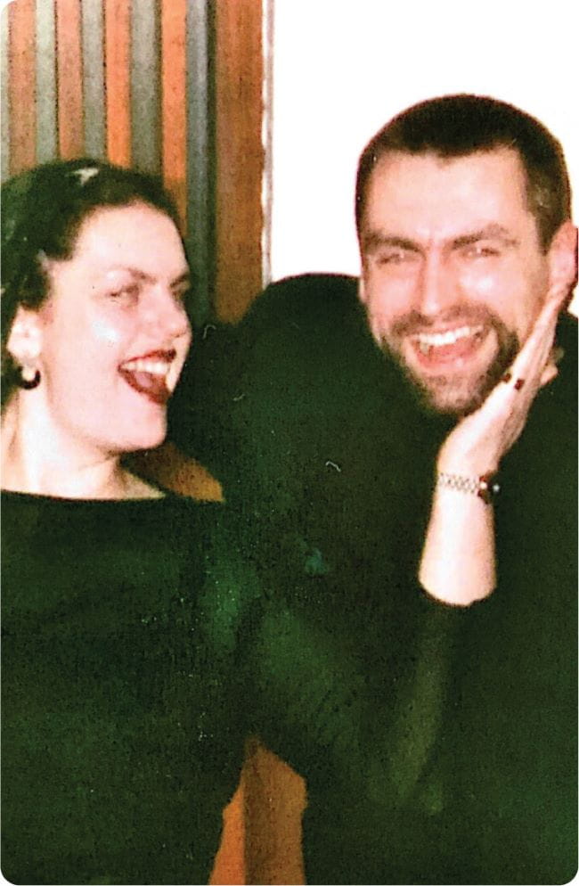 woman smiling and laughing with her brother